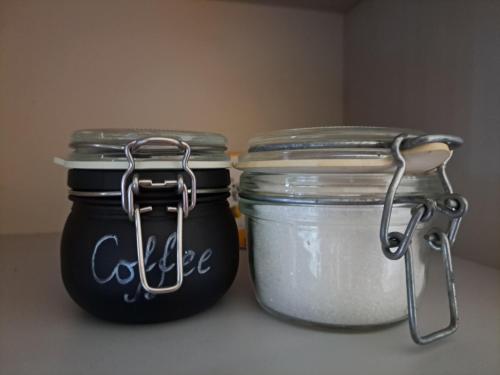 two jars of food sitting next to each other at Urban Escape Kaunas - Quiet Apartment 5 km from City Center in Kaunas