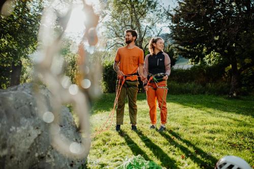 a man and a woman standing in a field with ropes at Hotel Gailtaler Hof in Kötschach