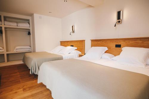 Hotel Boutique Lamar de Suancesにあるベッド