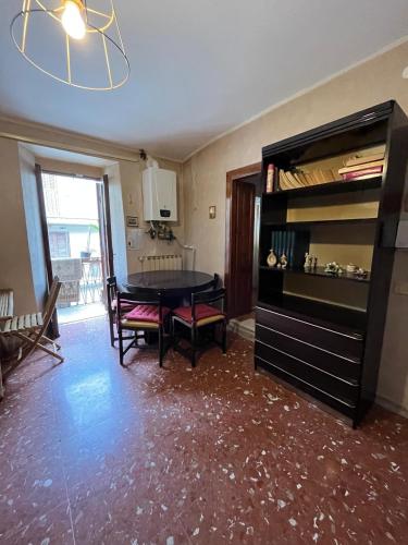 a living room with a table and a dining room at SURSUM CORDA private house in Orvinio