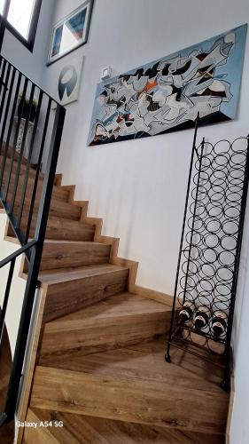 a staircase with a painting on the wall at Sitges BnB Superior Rooms in Sitges