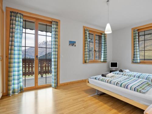Postel nebo postele na pokoji v ubytování Apartment Le Hameau by Interhome