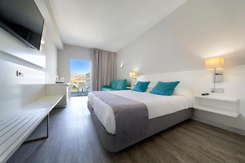Katil atau katil-katil dalam bilik di Hotel Caserio