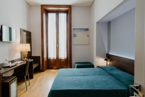 Postel nebo postele na pokoji v ubytování Liddo Boutique hotel
