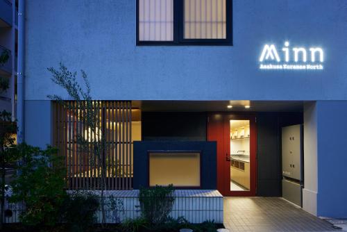 a blue facade of a building with a refrigerator at Minn Asakusa Kuramae North in Tokyo