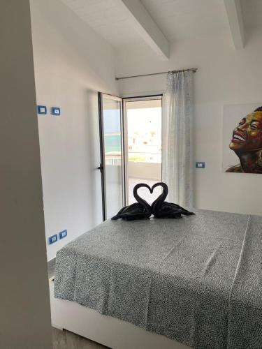 Ένα ή περισσότερα κρεβάτια σε δωμάτιο στο SGC Boa Vista Apartments