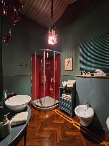 a bathroom with a shower and a sink and a toilet at L'Ape Regina in Ferrara