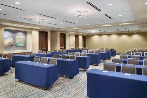 a large room with blue chairs in a room at Hampton Inn & Suites Denver Downtown Convention Center in Denver