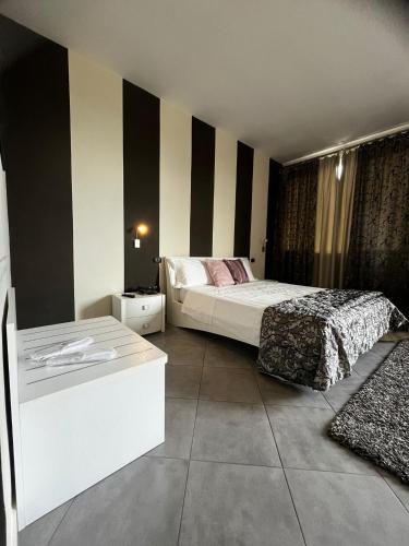 a hotel room with two beds at Hotel Saturday in Palma Campania