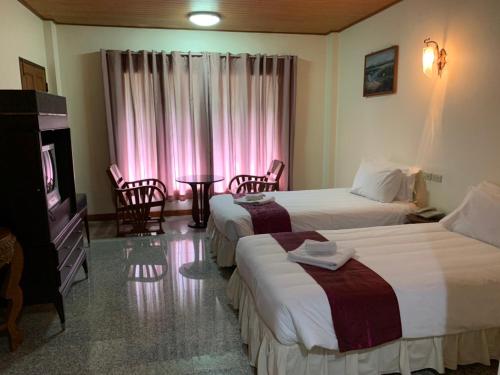 Katil atau katil-katil dalam bilik di Tak Andaman Resort & Hotel