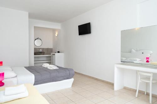Postel nebo postele na pokoji v ubytování ILIADA-ODYSSEAS RESORT