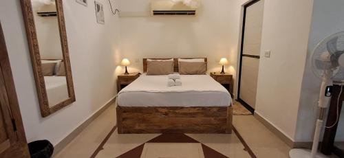 Cama o camas de una habitación en Jangala Baga Beach - French welcome, tropical garden, close to the beach