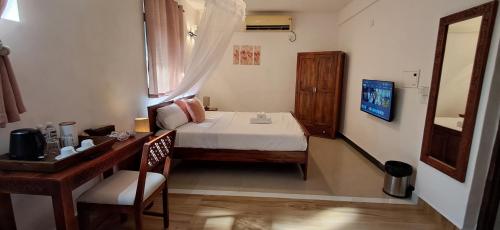 Cama o camas de una habitación en Jangala Baga Beach - French welcome, tropical garden, close to the beach
