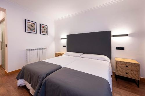 Postel nebo postele na pokoji v ubytování Hotel 103