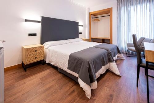 Postel nebo postele na pokoji v ubytování Hotel 103
