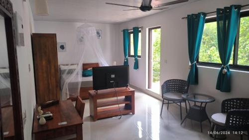 Zona de estar de Jangala Baga Beach - French welcome, tropical garden, close to the beach