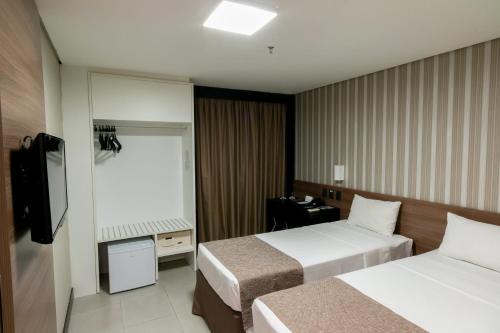 Katil atau katil-katil dalam bilik di WA Hotel Caruaru