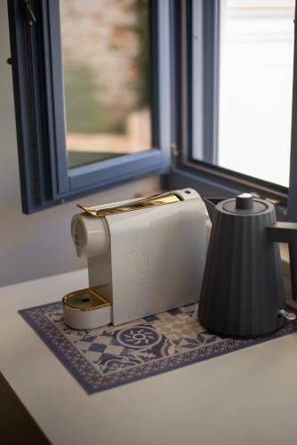 a toaster sitting on a counter next to a window at Borgofreddo Luxury Suite in Monopoli