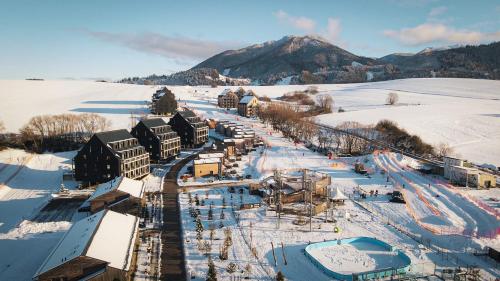an aerial view of a resort in the snow at Demänová Rezort in Liptovský Mikuláš