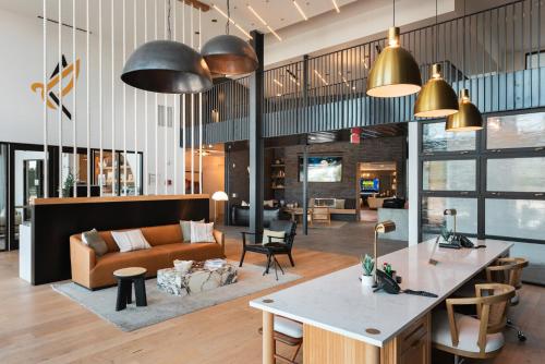 a living room with a couch and a table at Luxury Loft Style Apartment in Austin
