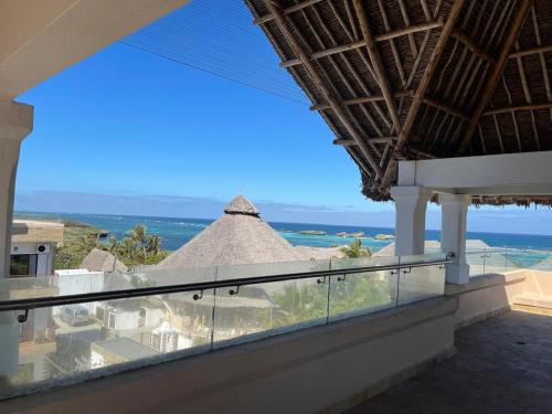 a view of the ocean from the balcony of a house at Mawe Zuri Resort in Watamu