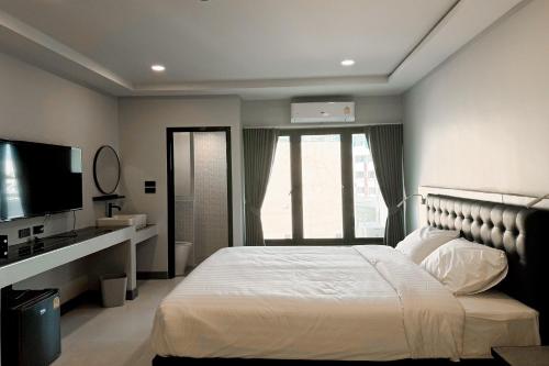 Postel nebo postele na pokoji v ubytování Smith Hotel