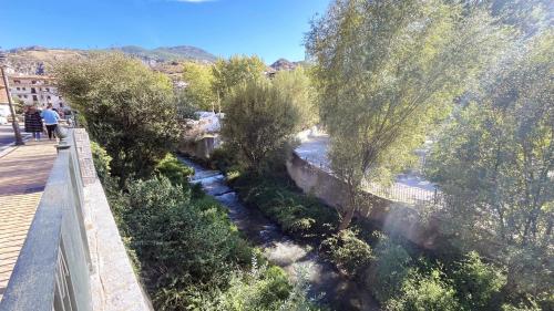 an aerial view of a river with trees at Mshome Sierra Nevada Monachil in Monachil
