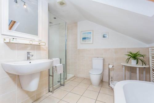 a bathroom with a sink and a toilet at The Bradshaw in Prestwick