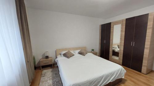 Postel nebo postele na pokoji v ubytování Zamca residence Suceava