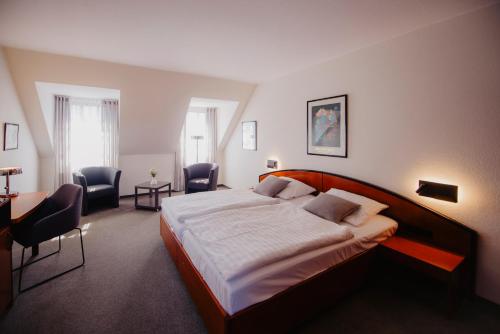 Una cama o camas en una habitación de Hotel-Restaurant Haselhoff