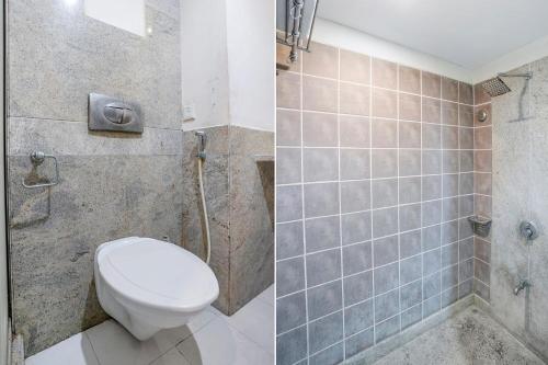a bathroom with a toilet and a shower at The Sky Comfort, Ahmedabad in Ahmedabad