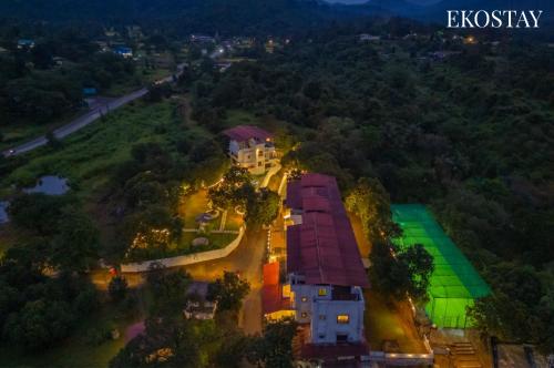 an overhead view of a house on a hill at EKOSTAY - Amanta Green 8BHK in Karjat