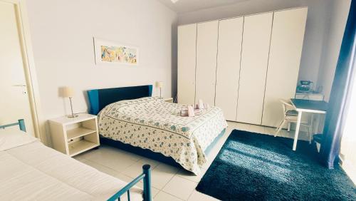 a bedroom with a bed and a table and a chair at Lovely 5 min walk to Saint Peter Basilica in Rome