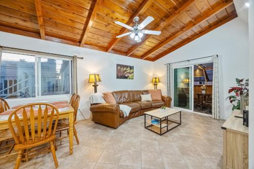 a living room with a couch and a table at Mimi's & Nana's Beach House in San Diego