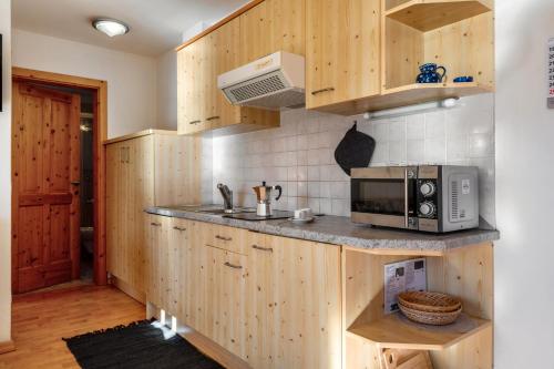 Kuchyň nebo kuchyňský kout v ubytování Apartments Campagnola