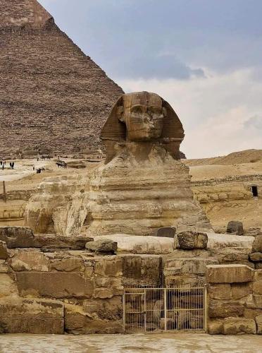 a statue in front of the pyramid at Fares pyramids Hostel in Cairo