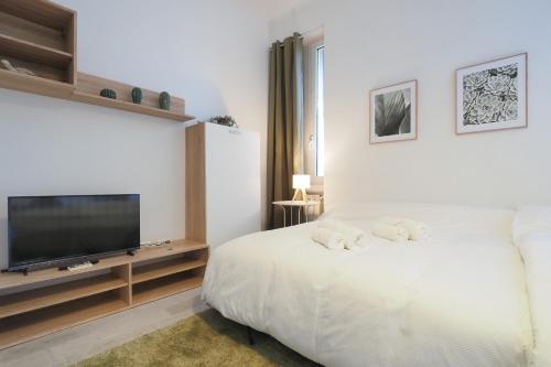 Un pat sau paturi într-o cameră la PrimoPiano - Volvinio