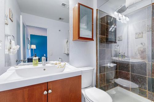 a bathroom with a sink and a toilet and a shower at Biarrtx D20 in Palm Springs