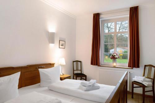 Postel nebo postele na pokoji v ubytování Gut Rattelvitz - Parterre West