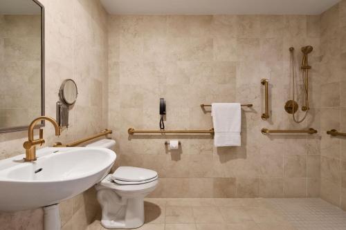 a bathroom with a sink and a toilet at JW Marriott Las Vegas Resort & Spa in Las Vegas