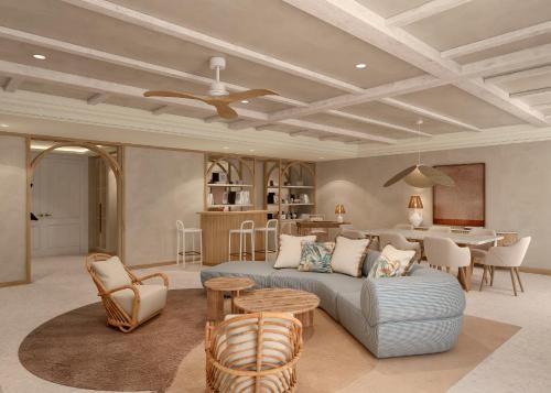 a living room with a couch and a table at Dreams Playa Esmeralda Resort & Spa - All Inclusive in Miches