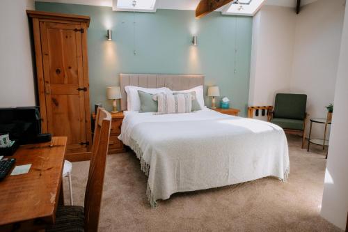 Ein Bett oder Betten in einem Zimmer der Unterkunft The Granary at Fawsley