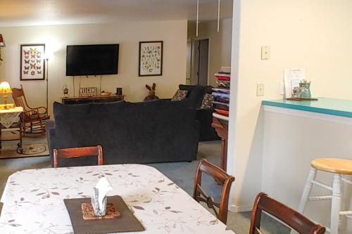 a living room with a couch and a table at Syringa House in McCall