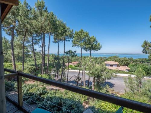 a view of the ocean from the balcony of a house at Villa Tramontane vue panoramique PYLA SUR MER in La Teste-de-Buch