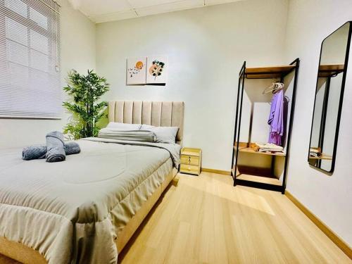 En eller flere senge i et værelse på My Muji Homestay I Massage Chair I Wifi 500 Mbps