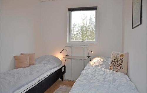Ένα ή περισσότερα κρεβάτια σε δωμάτιο στο Holiday Home Kirke Hyllinge With A Fireplace 04