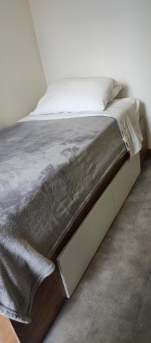 Ein Bett oder Betten in einem Zimmer der Unterkunft Ulivin Coliving
