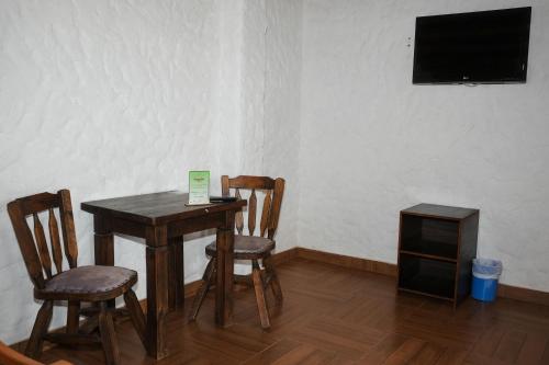 Μια τηλεόραση ή/και κέντρο ψυχαγωγίας στο Hotel Campestre Inaoska Ecospa