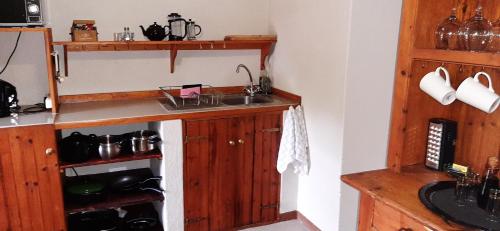 a kitchen with a sink and a counter at Schaefers' Halt in Dullstroom