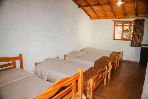 Ένα ή περισσότερα κρεβάτια σε δωμάτιο στο Hotel Campestre Inaoska Ecospa